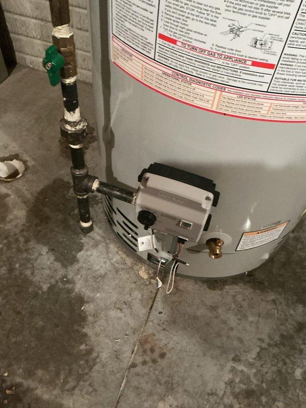 Replaced existing 50-gallon residential water heater with new Bradford White unit in basement utility room. Installation included connecting all water supply lines, gas line, and proper venting system, with condensate pump mounted for drainage management. All plumbing connections were secured with appropriate fittings and sealed to manufacturer specifications, and unit was tested for proper operation upon completion.