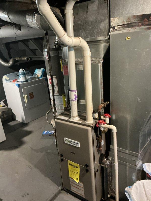 Responded to no-cooling complaint on 15-year-old central air conditioning system in recently purchased home. Upon inspection, found severely restricted airflow due to missing air filter in the Evcon furnace/air handler unit. Installed new 16x25x1 HDX filter in the filter rack and verified proper fit and seating. Confirmed system operation with adequate airflow restored to the evaporator coil and ductwork.
