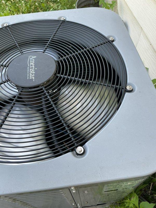 Responded to no-cooling call on 9-year-old American Standard air conditioning system. Customer reported that smart thermostat tripped breaker, and after resetting, outdoor condensing unit failed to operate. Upon arrival, inspected outdoor unit and confirmed fan motor and compressor were not energizing. Verified proper power supply to unit and checked electrical connections. Reset tripped breaker and tested system operation. Condensing unit restored to normal operation with fan blade spinning freely and compressor running. Verified adequate airflow through condenser coil and confirmed unit cycling properly on thermostat demand. System operating within normal parameters at time of departure.