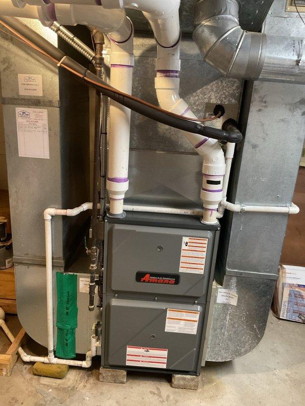 Completed comprehensive estimate for full air conditioning system replacement at residential property. Evaluated existing Amana furnace installation in basement utility area and exterior AC components, documenting current system configuration including ductwork, refrigerant lines, condensate drainage, and electrical connections. Provided customer with replacement options and specifications for new cooling equipment compatible with existing infrastructure.