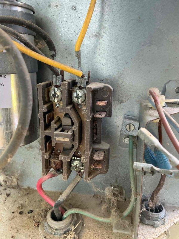 Responded to no-cooling complaint on one of three split-system air conditioning units serving individual suites. Upon inspection, confirmed condenser unit was receiving power but compressor and condenser fan motor were not operating. Air handler was running and circulating air through the space, but refrigerant system was not active. Identified failed contactor with severe corrosion and deterioration preventing proper electrical connection to compressor and fan motor. Contactor showed heavy rust, oxidation, and compromised terminal connections due to age and weather exposure. Documented electrical component condition and unit configuration for repair recommendations.