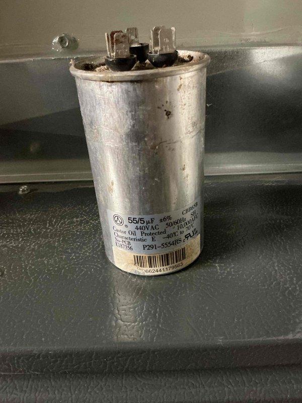 Responded to no cooling complaint and found failed dual-run capacitor with visible corrosion on terminals. Replaced defective 55/5 µF 440VAC capacitor, restored system operation, and verified proper thermostat communication and cooling function.