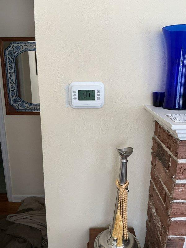 Completed full air conditioning system installation including new single-stage condenser unit, evaporator coil package, and flush metal lineset with R-11 refrigerant. Installed new concrete equipment pad, electrical disconnect box with whip connection, and programmed digital thermostat to ensure proper system operation and temperature control.