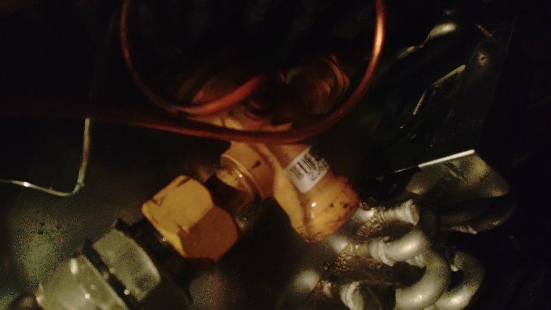 Responded to no cooling call where thermostat displayed 85°F despite being set to 65°F overnight. Upon arrival, inspected outdoor unit and identified failed printed circuit board (PCB) on condensing unit. Documented system components including service valves, refrigerant lines, and compressor assembly with unit identification number 6025E03336. Replaced defective PCB, restored power to system, and verified proper operation with cooling restored to residence.