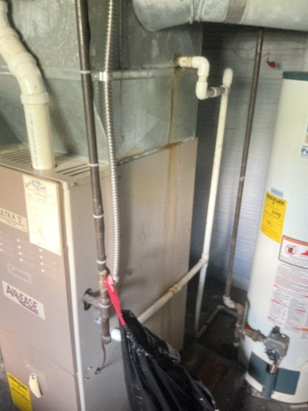 Responded to service call for 9-year-old air conditioning system experiencing water leakage from condensate piping and unit, with significant water accumulation in drain pan. Performed diagnostic inspection of HVAC system including Aire-Flo furnace and associated A/C components. Identified condensate drainage issue, inspected drain lines and pan for blockages or damage, and documented equipment condition with photographs for customer records.