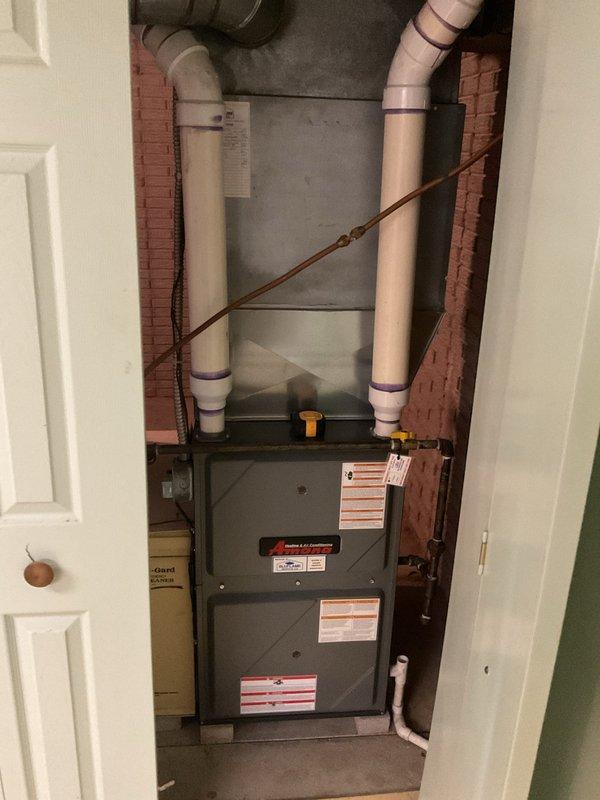 Conducted comprehensive evaluation of existing residential HVAC system located in basement utility area for equipment replacement estimate. Assessed current furnace and air handler unit, including connected ductwork, refrigerant lines, and condensate drainage system. Documented equipment configuration, noting beige metal furnace installation with vertical PVC exhaust and intake piping, copper refrigerant lines, and galvanized sheet metal distribution ductwork. Photographed system components to provide detailed visual reference for replacement proposal. Provided estimate for complete AC system replacement to address customer's cooling equipment needs.