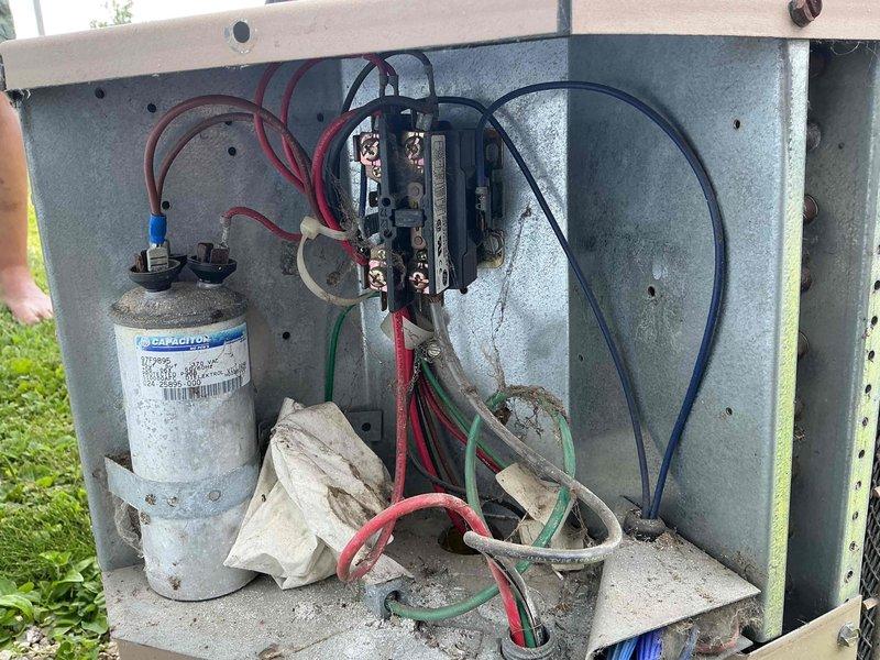 Responded to no cooling complaint on 14-year-old AC system with indoor temperature at 81°F. Upon inspection of outdoor unit, found failed capacitor with visible weathering and deteriorated condition affecting compressor operation. Replaced capacitor, tested contactor operation, and verified all electrical connections. System restored to proper cooling operation with normal airflow throughout home.
