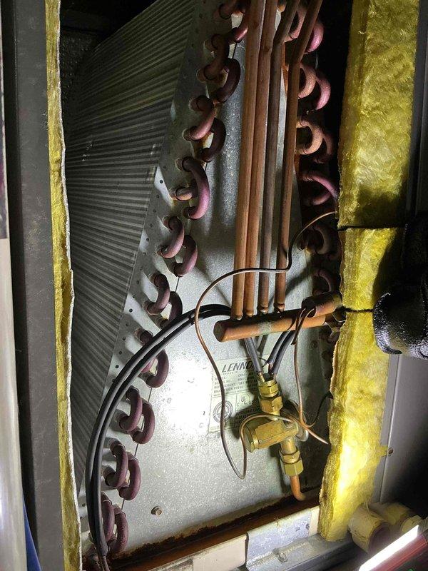 Completed comprehensive tune-up and inspection on 19-year-old Lennox air conditioning system per customer's request for 9 AM to 5 PM service window. Performed standard maintenance protocol including inspection of evaporator coil assembly, refrigerant lines, and associated components; all copper tubing and connections showed age-appropriate patina but remained functional with no visible refrigerant leaks detected at brass fittings or connection points.