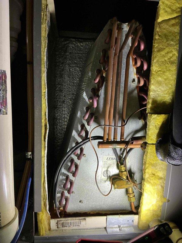 Completed comprehensive tune-up and inspection on 19-year-old Lennox air conditioning system per customer's request for 9 AM to 5 PM service window. Performed standard maintenance protocol including inspection of evaporator coil assembly, refrigerant lines, and associated components; all copper tubing and connections showed age-appropriate patina but remained functional with no visible refrigerant leaks detected at brass fittings or connection points.