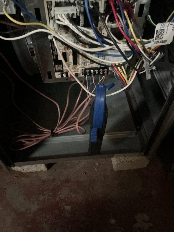 Responded to service call for residential air conditioning unit with reported fan malfunction on 5-year-old system. Upon arrival, performed comprehensive system inspection including visual assessment of outdoor condenser unit and electrical connections. Observed significant cobweb accumulation and dirt buildup on exterior electrical junction box and warning labels, indicating extended period without routine maintenance. Inspected indoor air handler wiring compartment, noting dusty conditions throughout interior components and control boards.

Tested condenser fan motor operation and verified electrical connections at both indoor and outdoor units. Examined all wire terminations at terminal blocks for proper connections and signs of overheating or corrosion. Noted some darkening at outdoor electrical terminals requiring attention. Completed preventative maintenance service including cleaning of accessible components and verification of all electrical connections. Documented equipment co