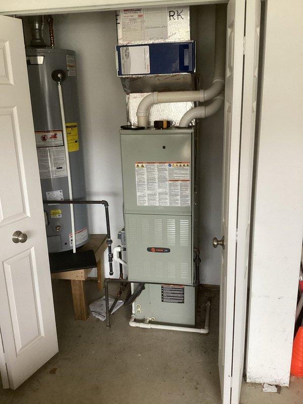 Completed comprehensive estimate for full HVAC system replacement at residential property. Evaluated existing outdoor air conditioning condenser unit mounted on concrete pad with electrical disconnect, along with indoor gas furnace and water heater configuration located in utility closet. Documented current equipment specifications, ductwork routing, and installation conditions through detailed photographic assessment to provide accurate replacement recommendations and system sizing requirements.