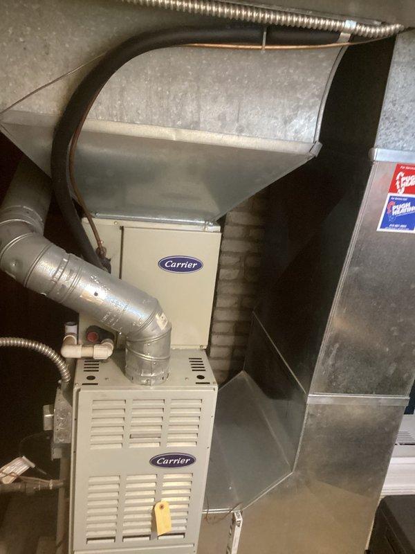 Completed comprehensive estimate for full HVAC system replacement at residential property. Evaluated existing Carrier furnace installation in basement utility area, including associated ductwork, plenum, and air handler components. Assessed outdoor condensing unit utilizing R-410A refrigerant positioned on concrete pad adjacent to home exterior. Documented current system configuration, equipment specifications, and installation conditions through detailed photographic documentation to provide accurate replacement recommendations and equipment sizing requirements.