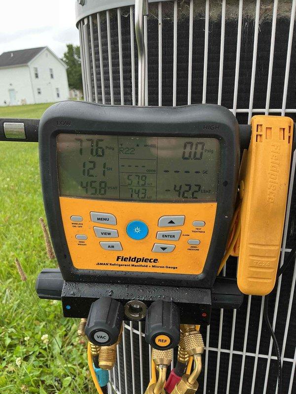 Completed comprehensive AC tune-up on 20-year-old outdoor condensing unit. Performed full system diagnostics using digital manifold gauges, measuring refrigerant pressures and temperatures with readings indicating 116°F discharge and operational pressures within acceptable range. Inspected condenser coil fins, electrical connections at disconnect box, and verified proper system operation to restore cooling functionality to the residence.