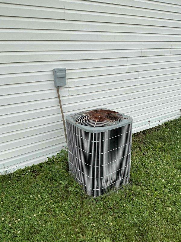 Completed comprehensive AC tune-up on 20-year-old outdoor condensing unit. Performed full system diagnostics using digital manifold gauges, measuring refrigerant pressures and temperatures with readings indicating 116°F discharge and operational pressures within acceptable range. Inspected condenser coil fins, electrical connections at disconnect box, and verified proper system operation to restore cooling functionality to the residence.
