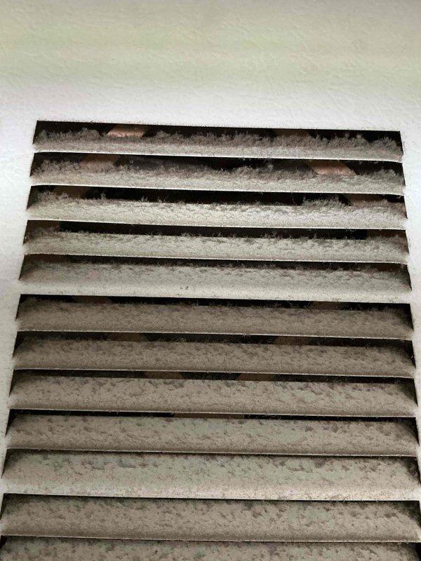 Performed comprehensive AC tune-up on 9-year-old system per customer request for cleaning and inspection. Conducted standard maintenance procedures including filter inspection, system cleaning, and operational verification. Documentation photos captured return air vent showing dust accumulation and HVAC unit exterior with visible equipment labels and normal wear consistent with age of system.