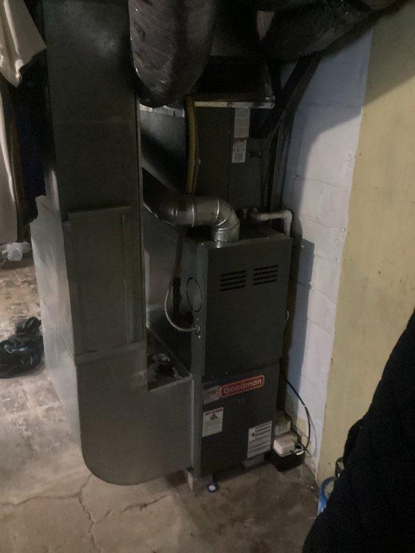 Provided comprehensive estimate for complete air conditioning system replacement at residential property. Evaluated existing Goodman furnace installation in basement mechanical room and aging outdoor condenser unit positioned on concrete pad adjacent to home exterior. Assessment included examination of current ductwork connections, electrical service routing, condensate drainage systems, and overall system compatibility to develop replacement specifications for new high-efficiency cooling equipment that will integrate with existing forced-air heating infrastructure.