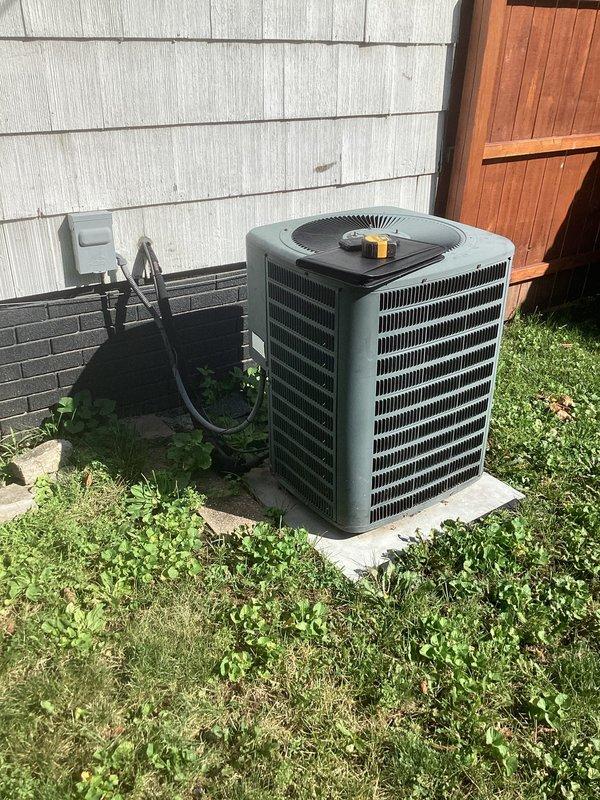 Provided comprehensive estimate for complete air conditioning system replacement at residential property. Evaluated existing Goodman furnace installation in basement mechanical room and aging outdoor condenser unit positioned on concrete pad adjacent to home exterior. Assessment included examination of current ductwork connections, electrical service routing, condensate drainage systems, and overall system compatibility to develop replacement specifications for new high-efficiency cooling equipment that will integrate with existing forced-air heating infrastructure.