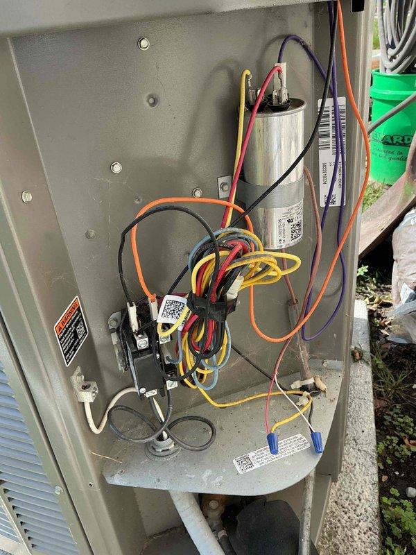 Performed routine cooling maintenance on a 3-year-old air conditioning system. Inspected electrical components including the capacitor, contactor, and associated wiring connections. All components were found to be in proper working condition with secure wire connections and appropriate voltage ratings. System operational and ready for continued service.