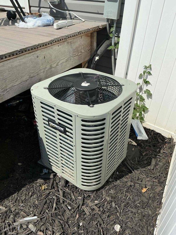 Performed seasonal maintenance on a Lennox split system air conditioning unit with indoor air handler located in basement and outdoor condenser positioned on exterior mulch bed. Completed comprehensive inspection of both components, including visual assessment of refrigerant lines, electrical connections, and overall system condition. Verified proper operation of condenser fan motor and compressor, checked refrigerant line insulation integrity, and inspected condensate drainage system at air handler. System age could not be determined from available information. Unit operational upon completion of maintenance service.