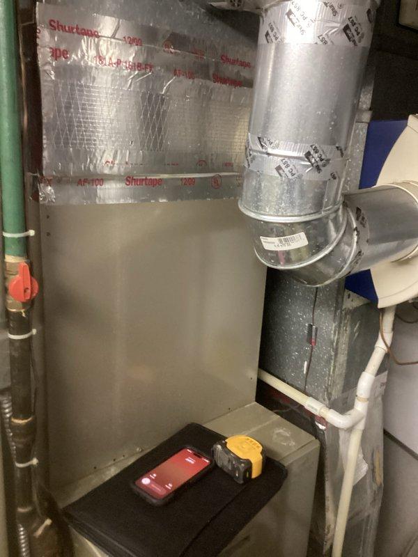 Completed comprehensive estimate for complete HVAC system replacement in residential basement installation. Assessed existing Bryant furnace and air handler unit for replacement, evaluating current ductwork configuration including silver foil-faced ducts with proper sealing and insulation. Documented existing system layout, including PVC condensate drainage lines, supply and return plenum connections, and vertical duct runs with reflective insulation wrap. Photographed current equipment positioning, clearances, and integration with existing plumbing infrastructure to develop accurate replacement specifications and ensure new equipment will meet proper installation requirements and building codes.