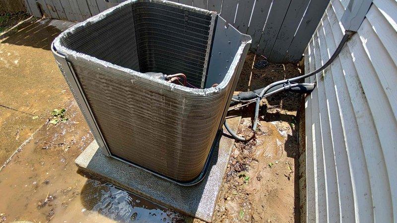 Completed preventive maintenance tune-up on an 8-year-old outdoor air conditioning condenser unit with cylindrical coil design. Unit was heavily soiled with accumulated dirt, dust, and debris requiring thorough cleaning of exterior surfaces and coil fins. Performed comprehensive inspection of refrigerant lines, electrical connections, and mechanical components to ensure optimal system performance and efficiency for the cooling season.