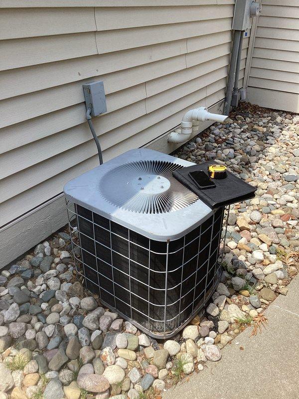 Conducted comprehensive site evaluation for complete HVAC system replacement at residential property. Assessed existing outdoor condensing unit positioned on concrete pad with landscape rock surround, noting electrical conduit, junction box, and PVC drainage lines. Documented current equipment specifications and clearance requirements for replacement unit installation.

Evaluated indoor components including existing Lennox furnace and air handler system located in mechanical room. Examined ductwork configuration, condensate drainage system, gas line connections, and electrical supply routing. Prepared detailed estimate for complete system replacement including new high-efficiency condensing unit, compatible furnace or air handler, necessary electrical upgrades, refrigerant line sets, and condensate drainage modifications to meet current code requirements.