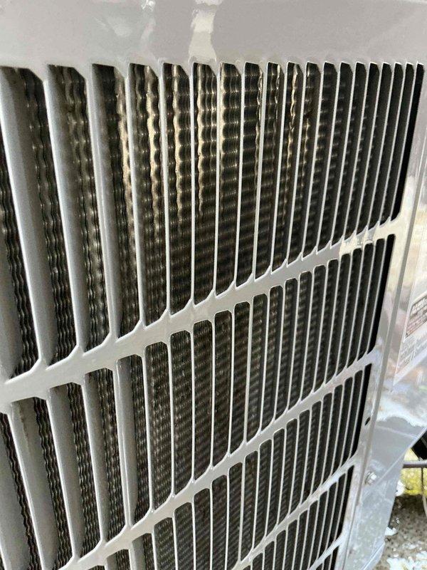 Responded to service call for 11-year-old air conditioning system reported as malfunctioning. Upon arrival, performed visual inspection of outdoor condenser unit and identified dirty condenser coils with accumulated debris and dust restricting airflow. Inspected indoor air handler and found heavily soiled air filter with significant particulate buildup, reducing system efficiency and airflow. Recommended immediate filter replacement and condenser coil cleaning to restore proper operation and prevent compressor strain.