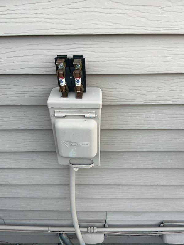 Completed preventative maintenance tune-up on 20+ year old residential air conditioning system. Performed comprehensive inspection of outdoor condenser unit, verified electrical disconnect and fuse operation, checked refrigerant lines for proper insulation and condition, and documented equipment status with photos. Unit operating within normal parameters upon service completion.