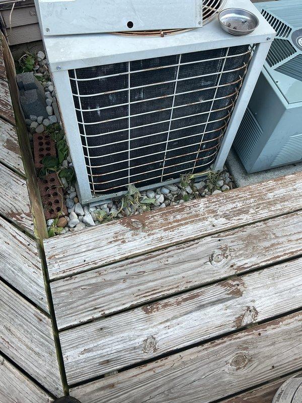 Completed preventative maintenance tune-up on 20+ year old residential air conditioning system. Performed comprehensive inspection of outdoor condenser unit, verified electrical disconnect and fuse operation, checked refrigerant lines for proper insulation and condition, and documented equipment status with photos. Unit operating within normal parameters upon service completion.