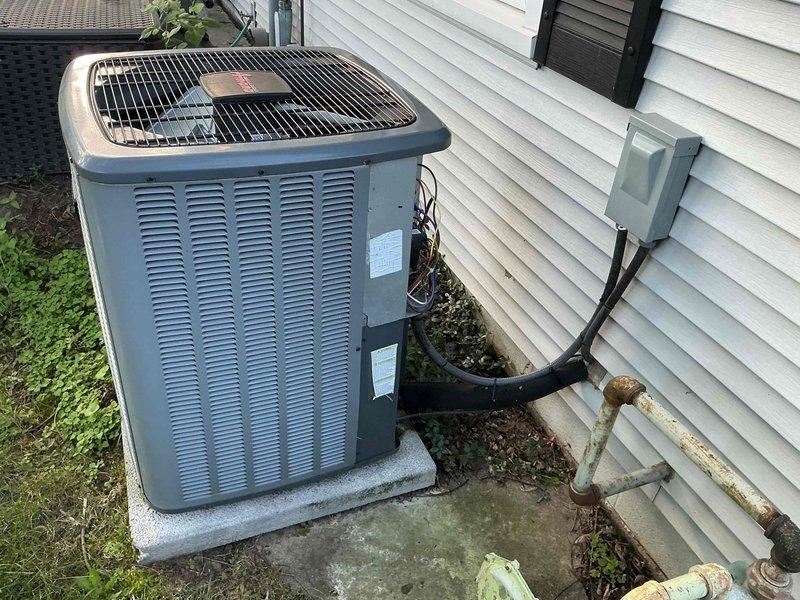 Completed preventive maintenance on 11-year-old residential air conditioning system. Performed comprehensive inspection of outdoor condensing unit and indoor air handler, checking electrical connections, refrigerant lines, and all system components. Verified proper operation of both units, noting age-related oxidation on copper line set but confirming system functionality remains within acceptable parameters.