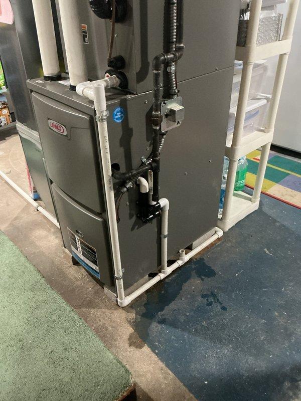 Completed comprehensive air conditioning tune-up on 3-year-old Lennox HVAC system installed in basement utility room. Performed standard preventative maintenance including filter inspection, refrigerant level check, electrical connection testing, condensate drain line verification, and overall system performance evaluation. All components found operating within normal parameters with no immediate service needs identified.