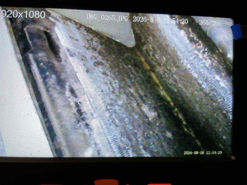 # HVAC Maintenance - Cooling Service

Performed comprehensive AC tune-up and maintenance check on a 10-year-old air conditioning system experiencing continuous daytime operation. Upon inspection, discovered significant contamination on the evaporator coil fins, including heavy mold growth, dirt accumulation, and biological buildup that was severely restricting airflow and reducing system efficiency. The dark green and black contamination was documented across multiple sections of the aluminum fins, indicating prolonged neglect and explaining the unit's inability to cycle properly. Conducted thorough cleaning of the evaporator coil to remove mold and debris, restored proper airflow through the heat exchanger, and verified system operation. The excessive buildup was causing the compressor to run continuously as the system struggled to achieve the desired temperature setpoint due to compromised heat transfer capacity.