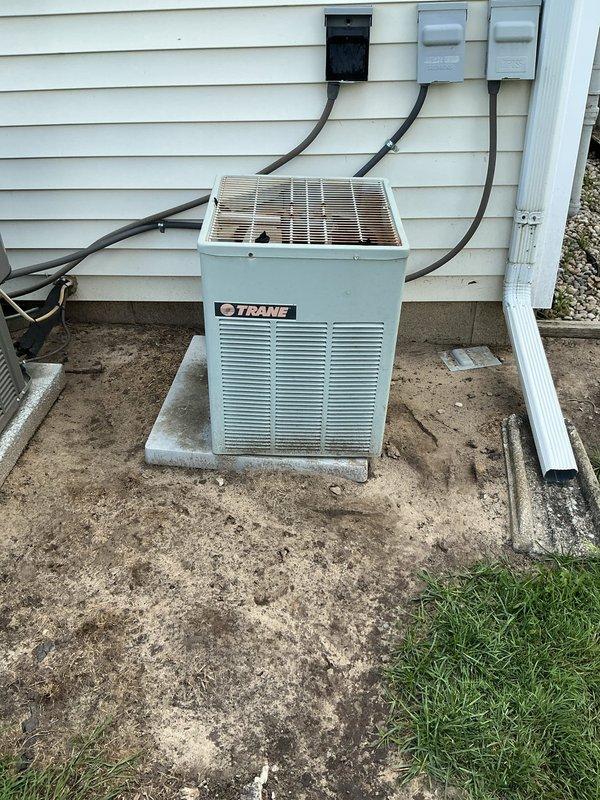 Responded to no cooling complaint on Trane air conditioning system. Upon arrival, found return air filter completely blocked with heavy dust and debris accumulation, severely restricting airflow to the system. Removed and replaced extremely dirty filter with new filter, restoring proper airflow to the evaporator coil. System operational and cooling properly after filter replacement; no refrigerant charge issues found as proper airflow was the root cause of cooling deficiency.