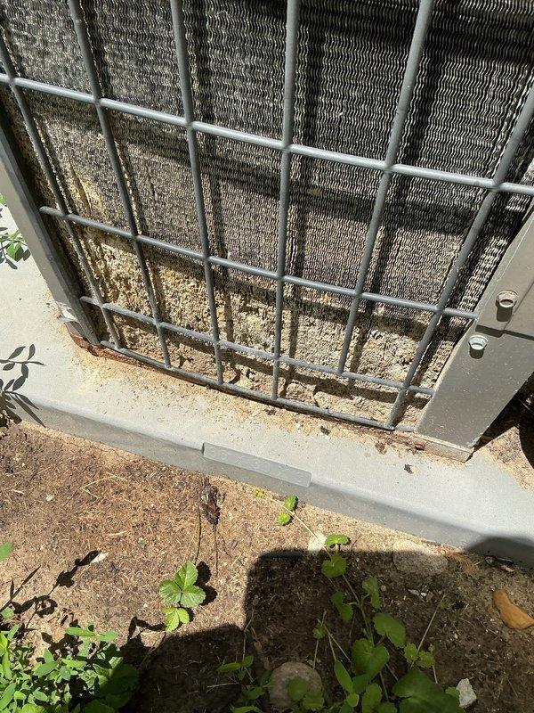 # HVAC Service Call - No Cooling Condition

Responded to service call for residential air conditioning system not operating. Unit is 20+ years old and located in backyard on concrete pad.

## Findings

Upon arrival, performed visual inspection of outdoor condenser unit. Found system completely non-operational with no power to unit. Condenser coils exhibited significant dirt and debris accumulation throughout, restricting airflow. Unit housing showed extensive weathering and age-related deterioration consistent with equipment exceeding normal service life expectancy.

## Actions Taken

Checked electrical connections at disconnect and confirmed no power supply to condenser. Tested contactor, capacitor, and compressor windings. Found dual run capacitor failed with zero microfarad reading on compressor terminal. Contactor contacts showed severe pitting and carbon buildup from years of operation.

Cleaned condenser coils using approved coil cleaner and low-pressure water rinse to remove acc