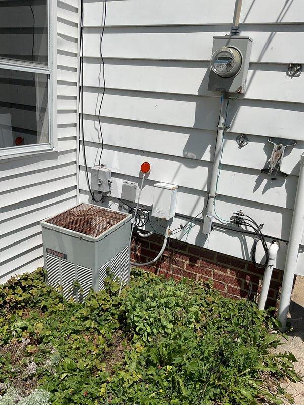 Conducted comprehensive assessment of existing residential HVAC system for air conditioning replacement. Evaluated current outdoor condensing unit showing signs of weathering and corrosion, along with interior furnace and mechanical components in utility closet. Documented existing equipment configuration including ductwork connections, refrigerant lines, electrical service, and clearance conditions to provide accurate replacement estimate and equipment specifications.