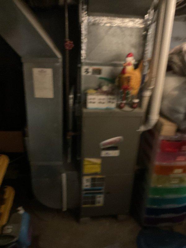 Conducted comprehensive assessment of existing HVAC system for complete replacement estimate. Evaluated outdoor condensing unit located on concrete pad adjacent to building exterior, noting equipment age, condition, and operational status. Inspected indoor air handler and furnace system in basement mechanical room, including existing ductwork configuration and insulation. Documented current system specifications, measured installation area clearances, and photographed equipment for replacement planning. Provided detailed estimate for new AC system installation including outdoor condenser unit, indoor components, refrigerant line sets, electrical connections, and necessary modifications to ensure proper system operation and code compliance.