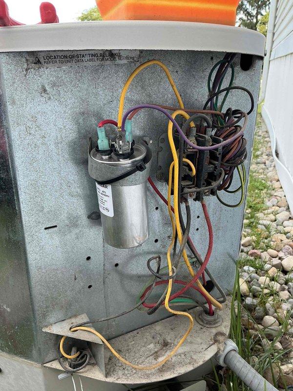 Completed comprehensive AC tune-up on outdoor condensing unit with system operating within normal parameters. Performed standard maintenance protocol including inspection of electrical components, capacitor, and contactor, verified proper operation of compressor and fan motor, and confirmed adequate airflow through condenser coil. Unit showing age-related cosmetic wear but all mechanical and electrical systems functioning properly with no immediate service needs identified.