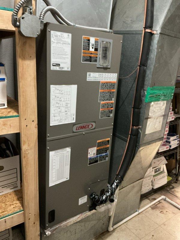 Completed full HVAC system installation in mechanical room consisting of new Lennox heat pump and upflow air handler. Installed air handler on existing base with new heat strips for supplemental heating. Ran new refrigerant line set with proper insulation and flushed lines to ensure system integrity. Relocated outdoor heat pump unit approximately three feet from meter on new equipment pad with pump-up blocks for proper drainage and clearance. Installed new metallic ductwork with reflective insulation to connect air handler to existing distribution system. Ran new electrical disconnect and whip for code-compliant power supply to outdoor unit. Mounted and wired new thermostat for system control. Tested all electrical connections, verified proper refrigerant charge, and confirmed heating and cooling operation across all system components.
