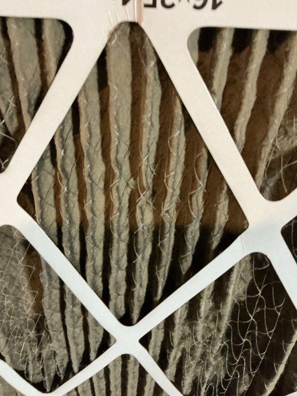 # HVAC Service Call - No Cooling Complaint

Responded to emergency service call for air conditioning system not cooling. Unit age between five and ten years old.

## Diagnostic Findings

Upon arrival, performed comprehensive system evaluation. Inspected air handler and discovered severely restricted airflow due to heavily soiled air filter. Filter media showed significant dust and debris accumulation throughout pleated surfaces, substantially reducing system capacity and efficiency. Restricted airflow condition was causing inadequate cooling performance and potential stress on compressor and blower motor components.

Examined flexible ductwork connections at air handler. Noted corrugated flex duct in serviceable condition with intact insulation jacket and proper compression fittings.

## Service Performed

Replaced dirty air filter with new high-efficiency pleated filter appropriate for system specifications. Restored proper airflow through air handler and ductwork system.

Verified bl