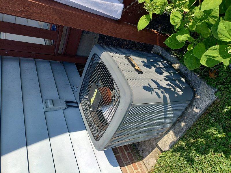 Completed preventive maintenance on an 8-year-old residential air conditioning system. Inspected outdoor condenser unit located on concrete pad adjacent to deck, verified proper airflow through louvers and cleaned debris from unit exterior. Performed indoor inspection of air handler and associated ductwork in basement utility area, checked refrigerant lines, electrical connections, and confirmed system operational status for cooling season.