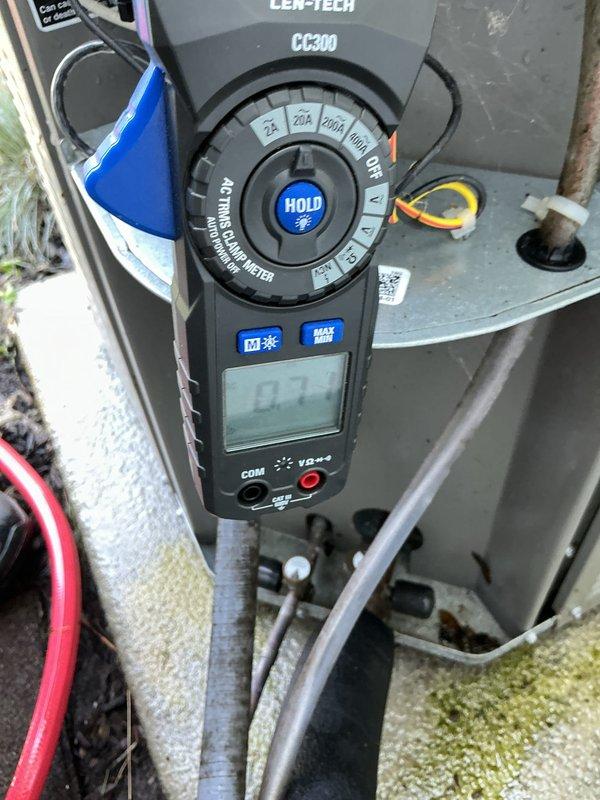 Completed preventive maintenance tune-up on 6-year-old outdoor condensing unit. Performed electrical diagnostics using clamp meter to verify proper amperage draw and system performance. Unit's condenser coil showed significant accumulation of dirt, dust, and debris on fins, which was addressed during maintenance to restore proper airflow and heat transfer efficiency.