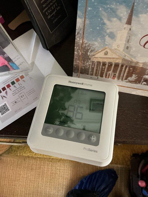 Responded to service call for malfunctioning Honeywell Home ProSeries thermostat connected to a one-year-old AC system. Upon arrival, verified thermostat was displaying erratic behavior with no error messages or blank screen conditions. Removed thermostat faceplate and inspected all wiring connections at terminal block, confirming proper wire placement including R, C, Y, G, and W terminals. Performed system reset by removing thermostat from wall plate, cycling power at breaker, and reinstalling unit. Verified all colored wires were securely seated in appropriate terminals with no loose connections. Tested thermostat functionality through multiple cooling cycles to ensure proper communication with AC unit. System restored to normal operation with accurate temperature readings and responsive controls.