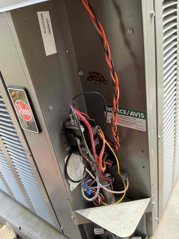 Completed preventative maintenance on 12-year-old Rheem air conditioning system. Performed system inspection with access panel removal, checked electrical connections and capacitor condition, and verified proper operation of all components. Unit showed normal wear with some dust accumulation; all electrical connections secure and refrigerant lines intact.