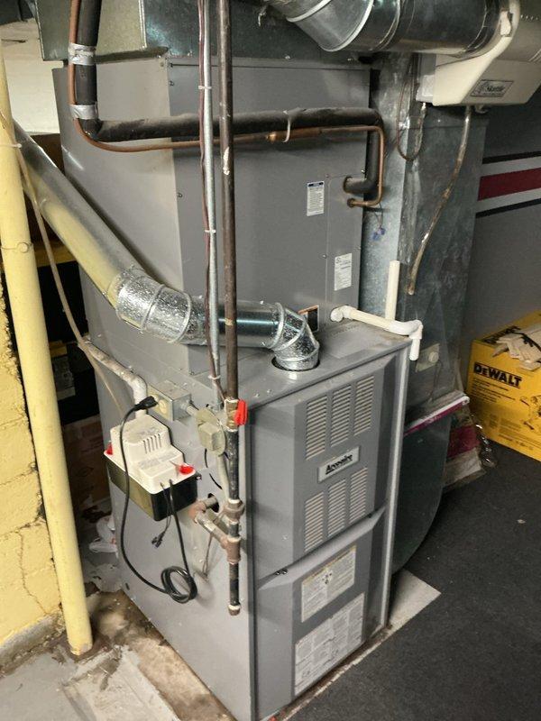 Responded to service call for water leakage beneath furnace during A/C operation. Upon inspection, identified disconnected condensate drain line from evaporator coil assembly. Reconnected drain line to proper fitting, verified secure connection, and tested system operation to confirm leak was resolved and drainage functioning properly.