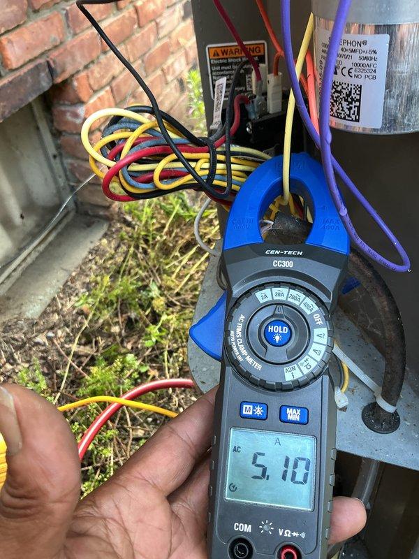 Performed routine air conditioning maintenance on 5-year-old system. Measured electrical current draw using clamp meter, reading 5.10 amps, and inspected all electrical connections, terminals, and capacitor within the outdoor unit. All components found operating within normal parameters; no repairs required at this time.