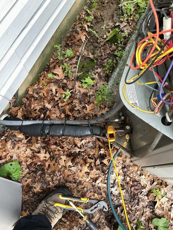 Completed routine air conditioning maintenance on a 5-year-old system. Inspected electrical components including capacitor and motor connections, verified proper wiring and terminal integrity, and cleared debris from outdoor unit area to ensure adequate airflow and system performance.