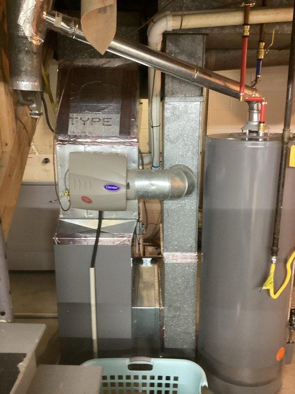Completed estimate for replacement of existing 3-ton air conditioning system. Inspected current Carrier furnace and associated HVAC infrastructure in basement mechanical room. Evaluated existing ductwork configuration, including main trunk lines and insulated sections. Assessed clearances and spatial requirements for new condenser unit installation. Documented equipment specifications, electrical requirements, and compatibility with existing gas furnace system. Reviewed condensate drainage routing via PVC piping and verified proper venting configuration. Provided comprehensive replacement options and equipment recommendations to customer.
