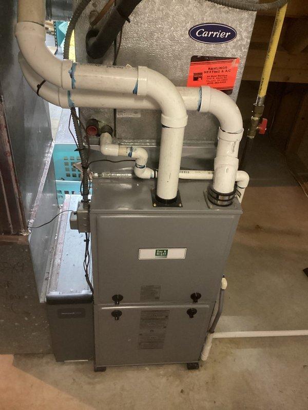 Completed estimate for replacement of existing 3-ton air conditioning system. Inspected current Carrier furnace and associated HVAC infrastructure in basement mechanical room. Evaluated existing ductwork configuration, including main trunk lines and insulated sections. Assessed clearances and spatial requirements for new condenser unit installation. Documented equipment specifications, electrical requirements, and compatibility with existing gas furnace system. Reviewed condensate drainage routing via PVC piping and verified proper venting configuration. Provided comprehensive replacement options and equipment recommendations to customer.