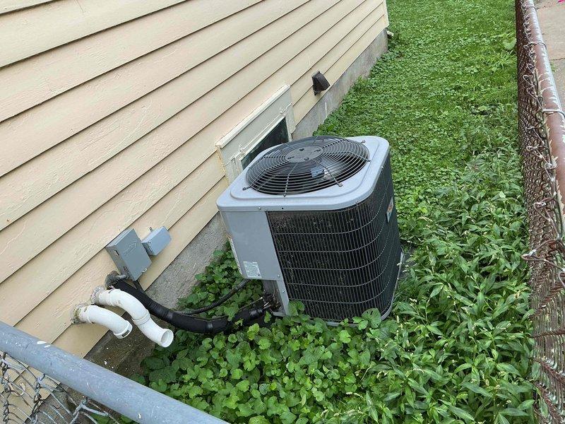 Responded to no cooling call on 8-year-old residential air conditioning system. Customer reported outdoor condenser fan not operating. Upon inspection, found outdoor unit with inoperative condenser fan motor preventing proper heat rejection and airflow. Diagnosed failed fan motor, replaced component, and restored system to normal operation. Verified proper amperage draw, confirmed adequate airflow through condenser coil, and tested system through complete cooling cycle with satisfactory performance.