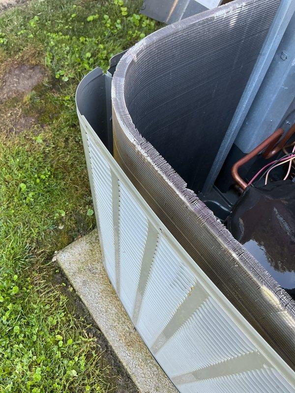 Completed comprehensive air conditioning tune-up and preventive maintenance on residential outdoor condensing unit. Performed system inspection, verified proper operation of condenser coil and refrigerant lines, and documented equipment condition with photos showing clean coil surfaces and intact copper piping connections.